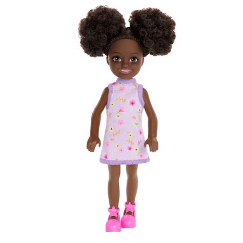 Muñeca Chelsea con molinete y vestido morado