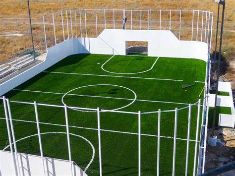 Estadio Modelo cancha de fútbol sintético