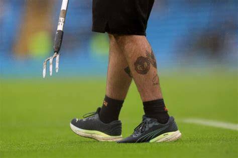 jardinero césped Etihad Stadium tatuaje